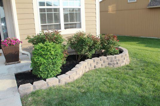 You can also make your flower garden more interesting by building a cinder block fence.